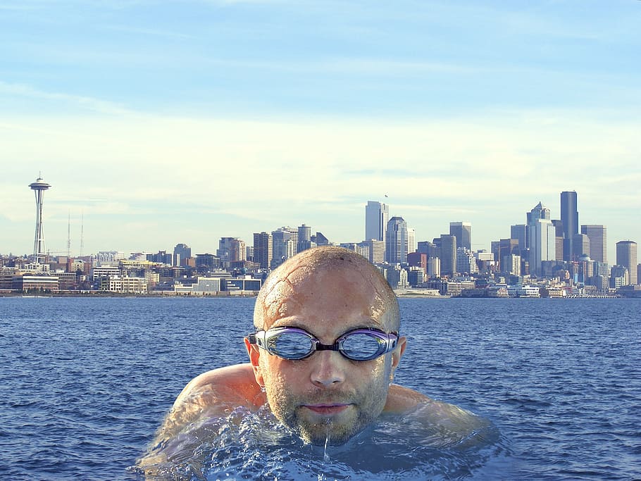 man on body of water facing camera, float, swim, seattle, city HD wallpaper