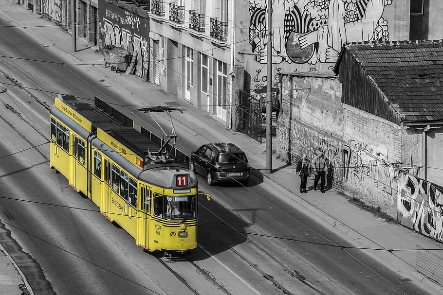 yellow city tram selective color photo, belgrade, train, street