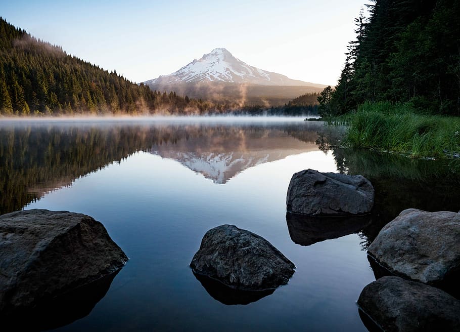calm body of water with rocks near trees and mountain, body of water with rock formation HD wallpaper