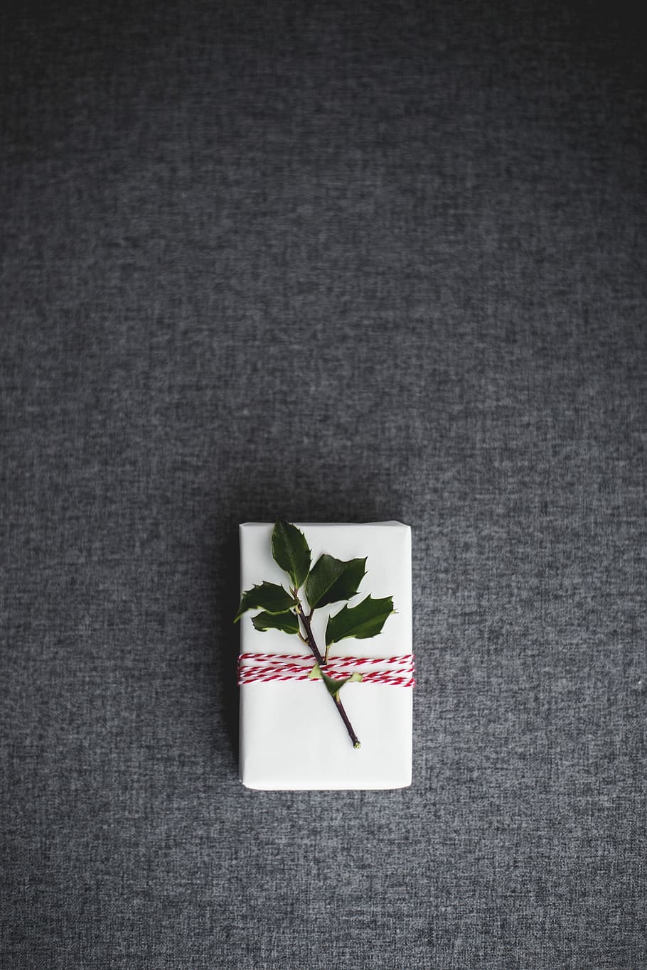 green leaves on white box placed on gray textile, green leaf on white box HD wallpaper