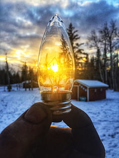 Person Holding Led Bulb in Front of Sunrise Photo, blur, bright HD wallpaper