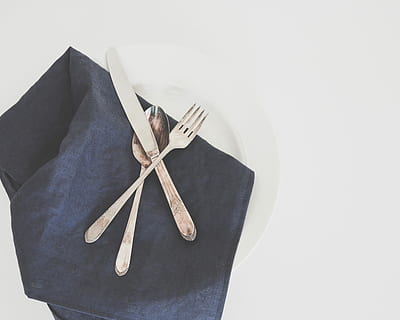 gray fork, spoon, and butter knife on plate with black table napkin, silver kitchen knife, fork, and spoon on plate HD wallpaper