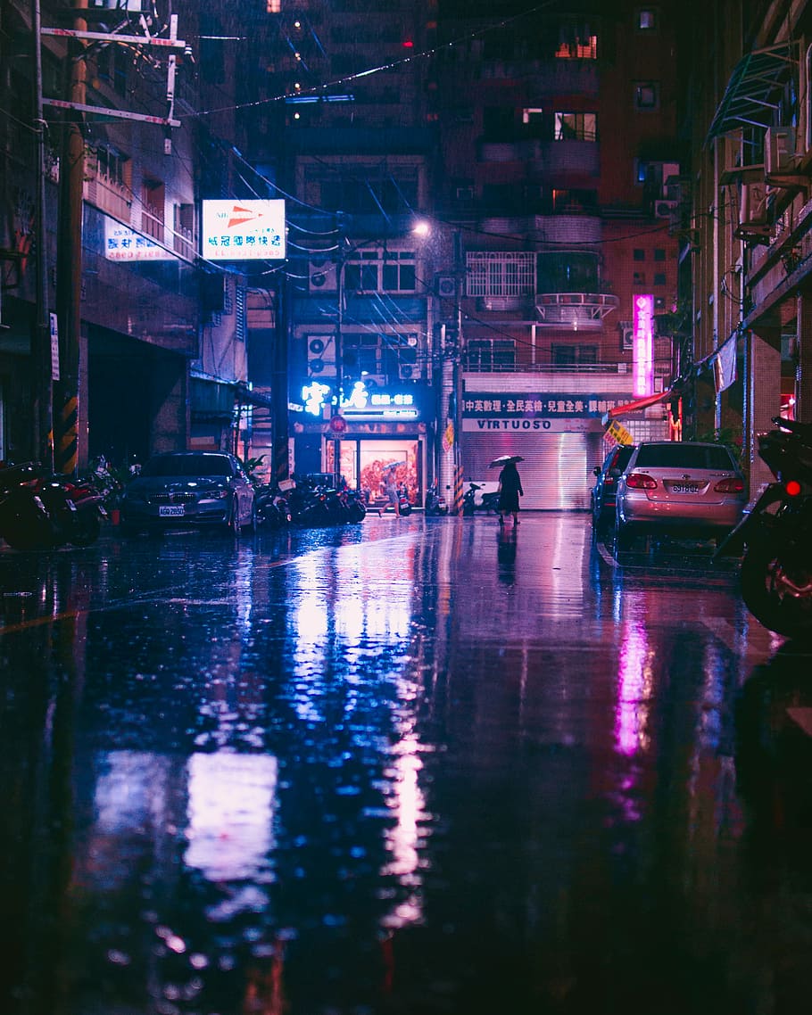 Rainy in Taipei, person holding umbrella and walking on street