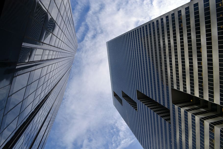 low-angle photography of high-rise building at daytime, skyline district