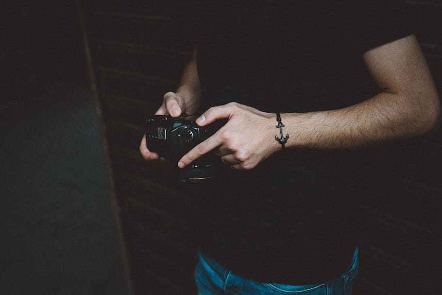 Photography of Man Holding Dslr Camera, anchor, bracelet, dark HD wallpaper