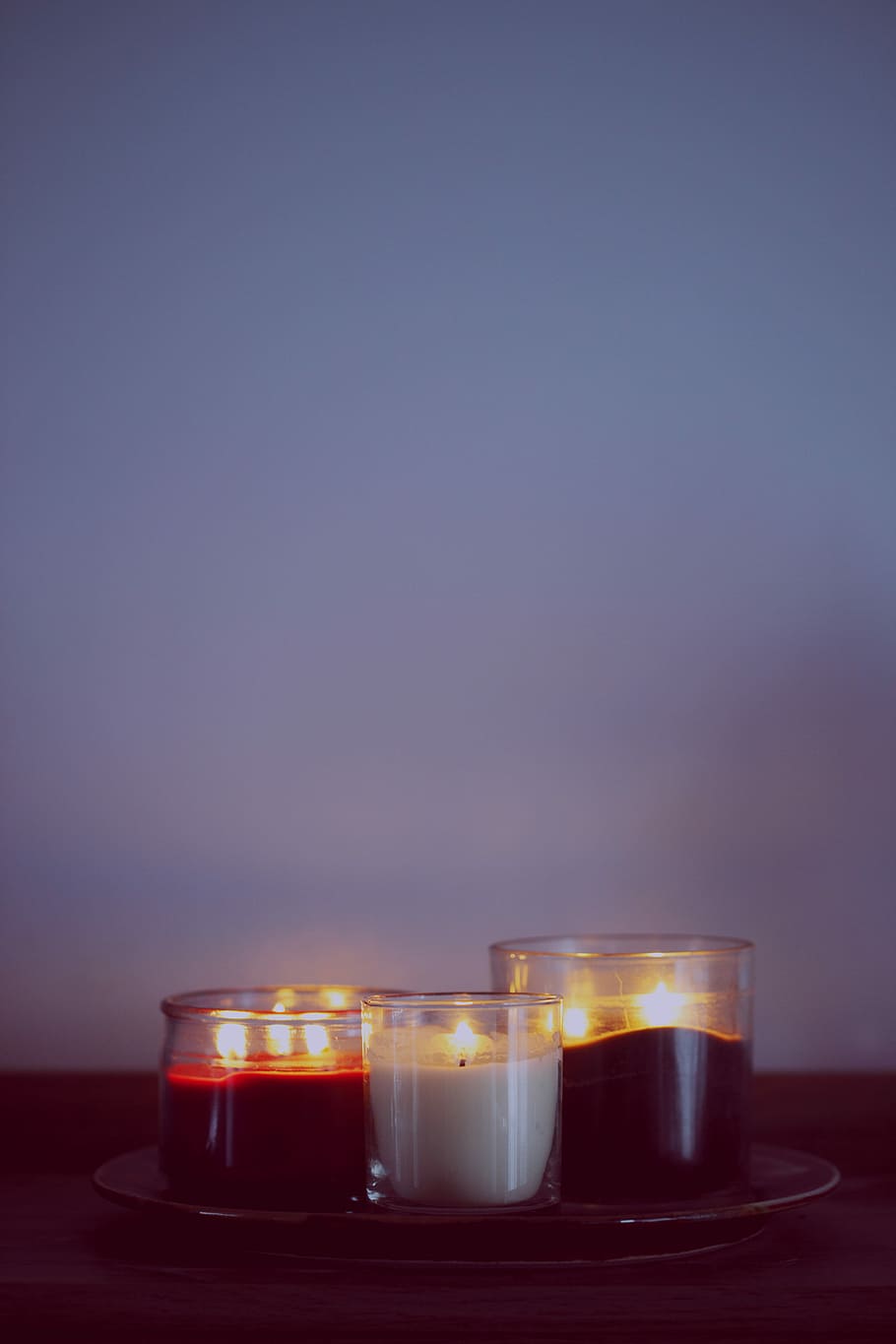 three clear glass cups, three clear glass candle holders, light HD wallpaper