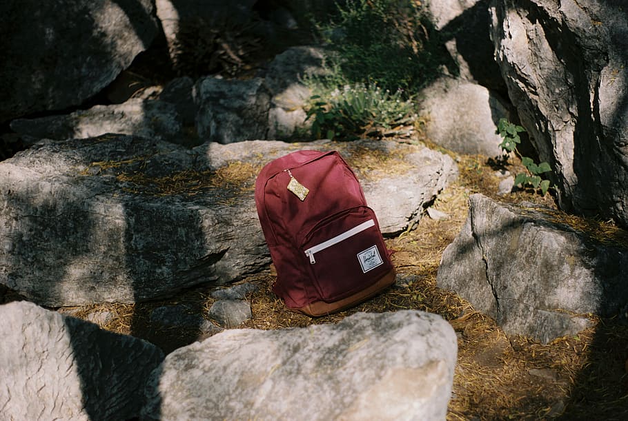 red backpack on top of rock, red backpack on top of boulder, bag HD wallpaper