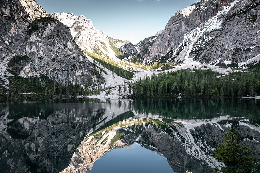 mountain reflected on body of water at daytime, mountain with snow near lake HD wallpaper