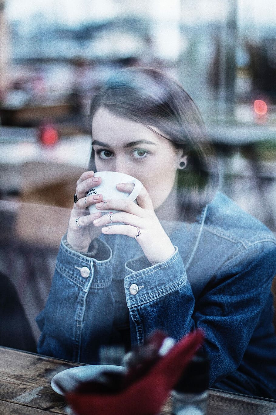 woman wearing blue denim jacket holding white ceramic teacup, woman drinking white cup HD wallpaper