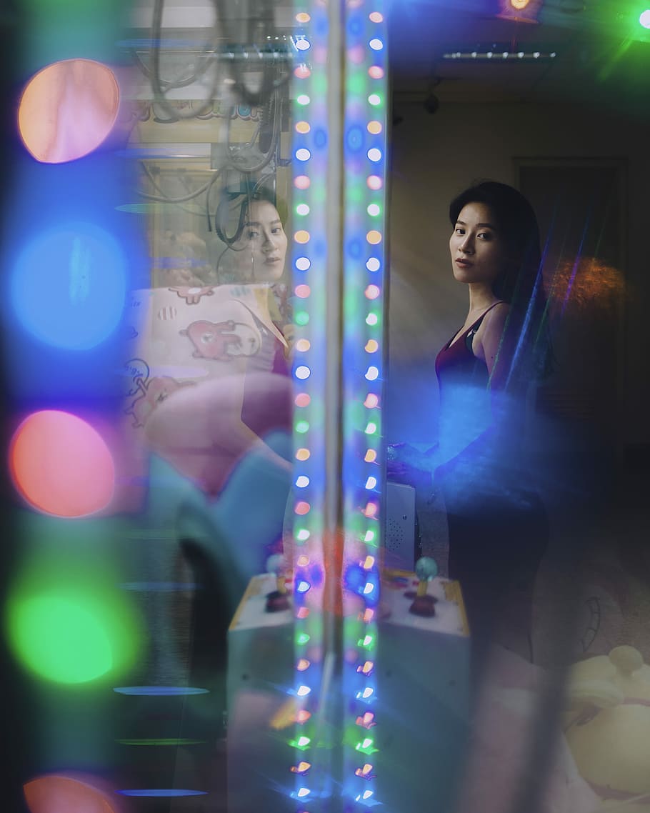 woman standing inside room with lights, one person, illuminated HD wallpaper