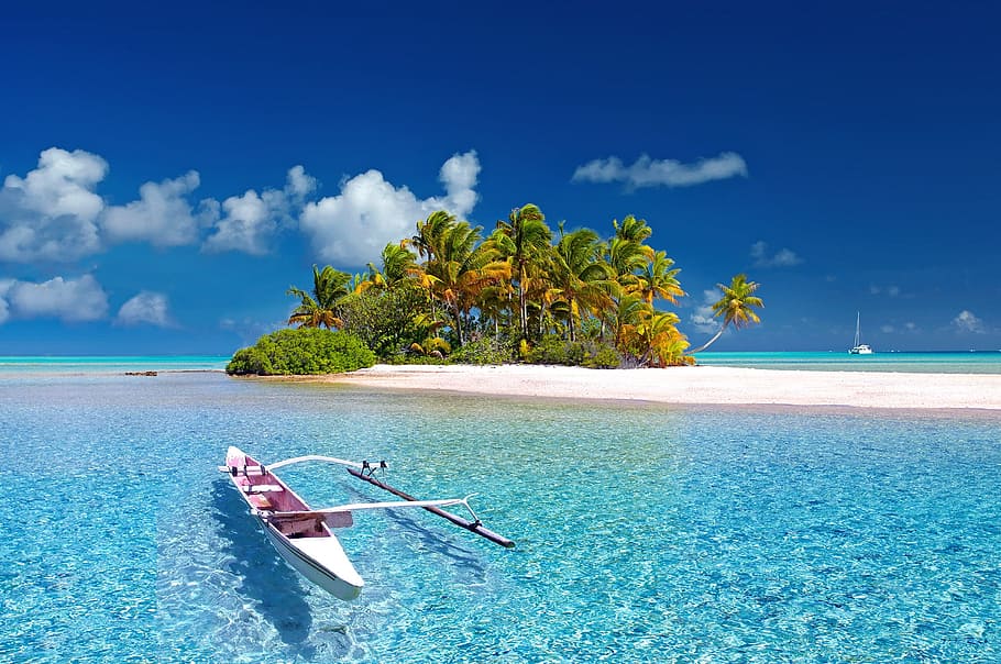 close up photo of white row boat on shore, polynesia, french polynesia