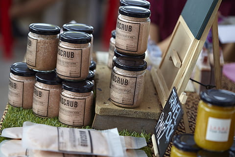 assorted glass jars on brown wooden surface, scrub, body scrub HD wallpaper