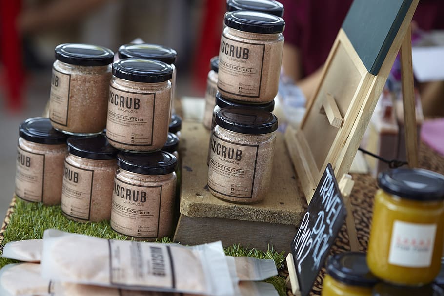 assorted glass jars on brown wooden surface, scrub, body scrub HD wallpaper