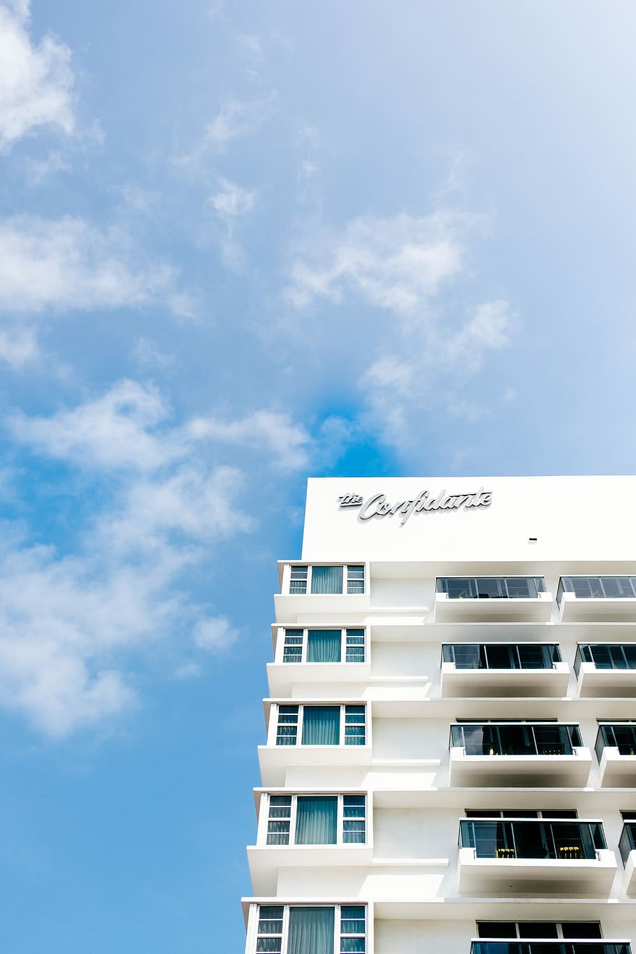 white establishment, white concrete building under white and blue skies HD wallpaper