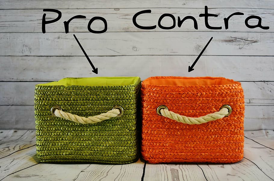 two green and orange folding bins on wooden surface, pros and cons HD wallpaper