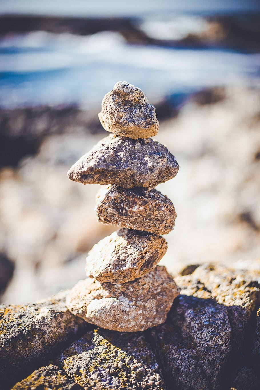 Balance through simplicity, close up photography of pile of stones HD wallpaper
