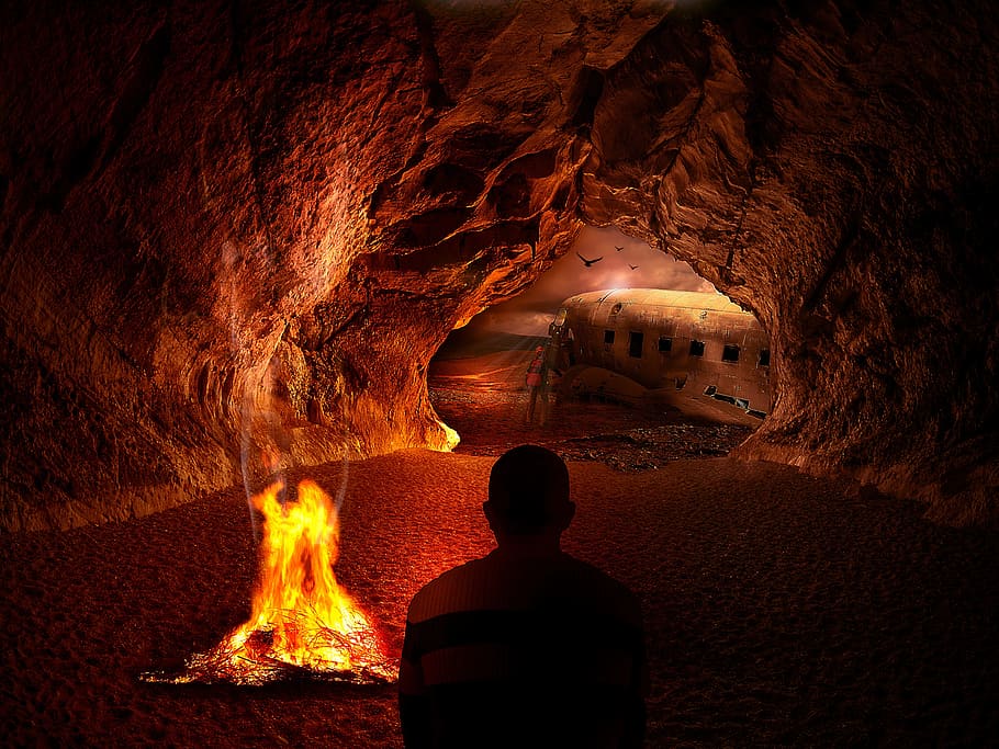 man near campfire in cave photo, desert, landscape, nature HD wallpaper