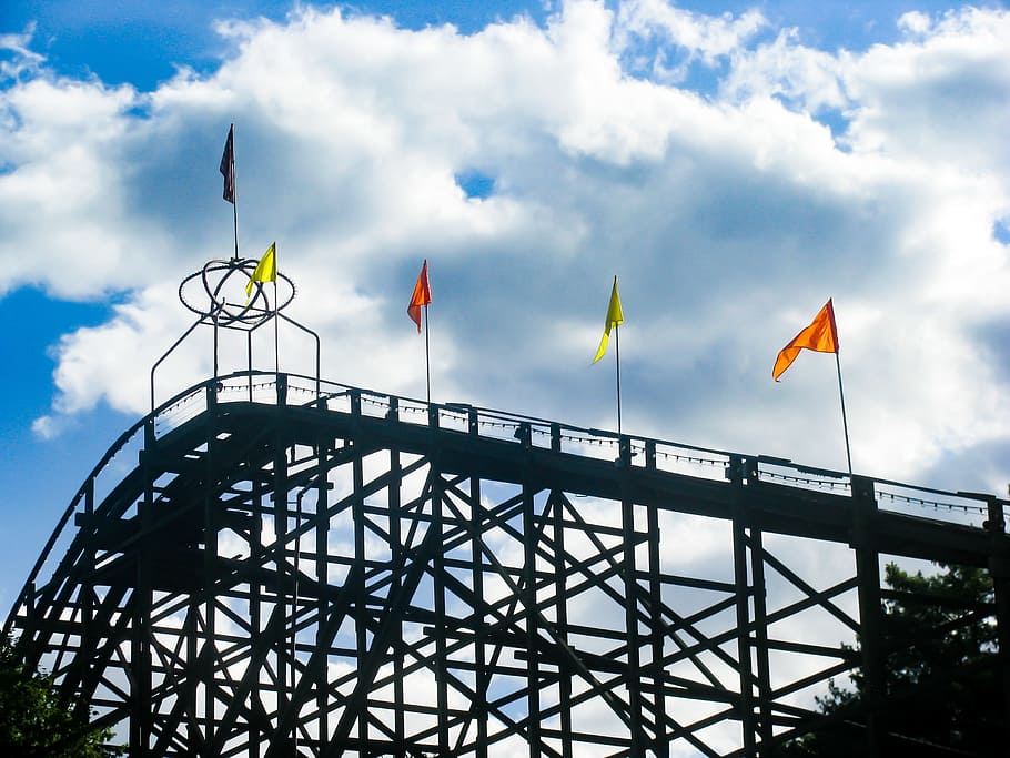rollercoaster, amusement park, fun, ride, flags, sky, clouds HD wallpaper