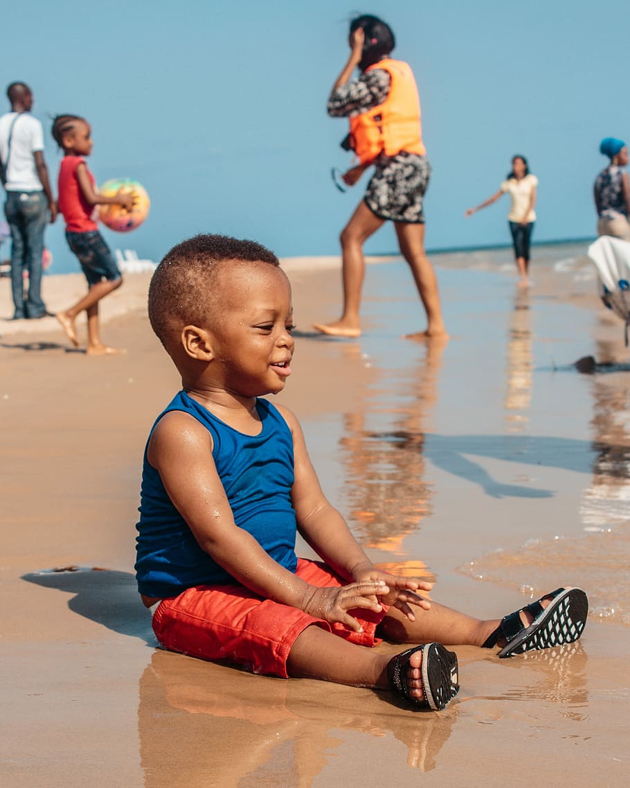 boy sitting on the seashore during daytime, baby, black, african, HD wallpaper