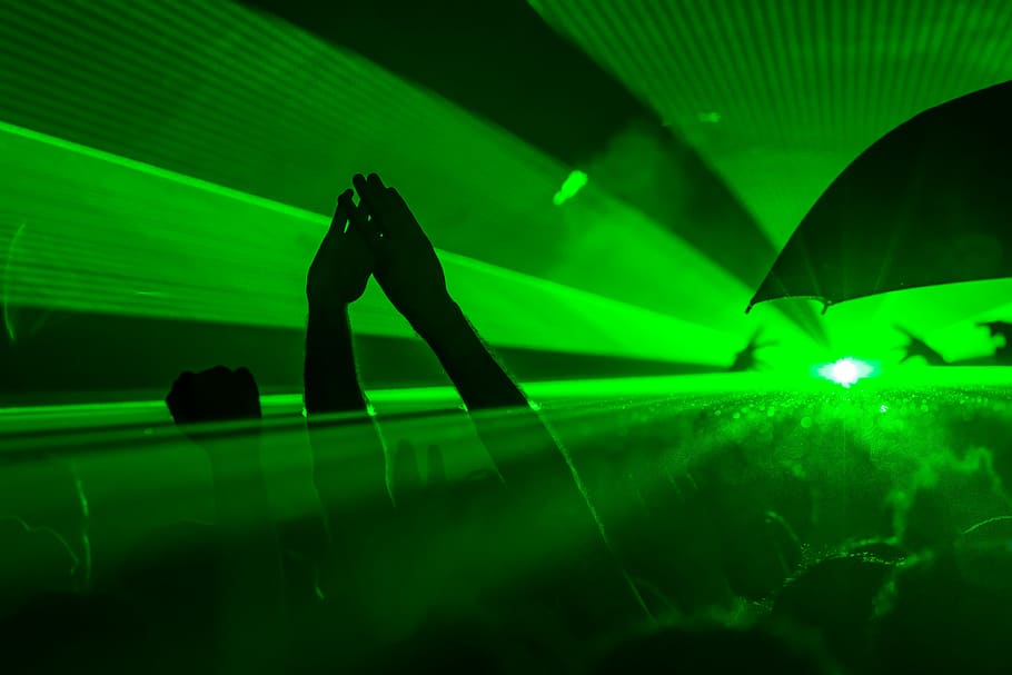 group of people dancing on green neon laser lights, party, music