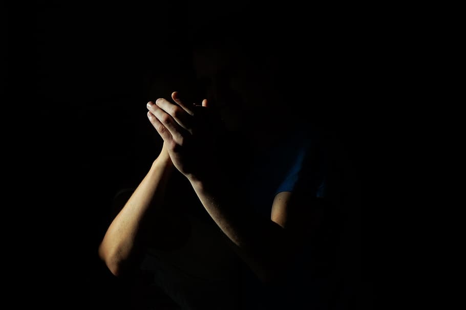 closeup photo of person arms on black background, clapping, hands