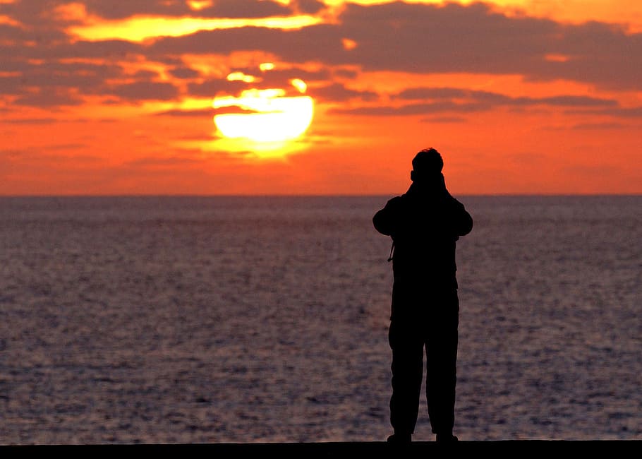solitary figure, flight deck, aircraft carrier, sunset, sea
