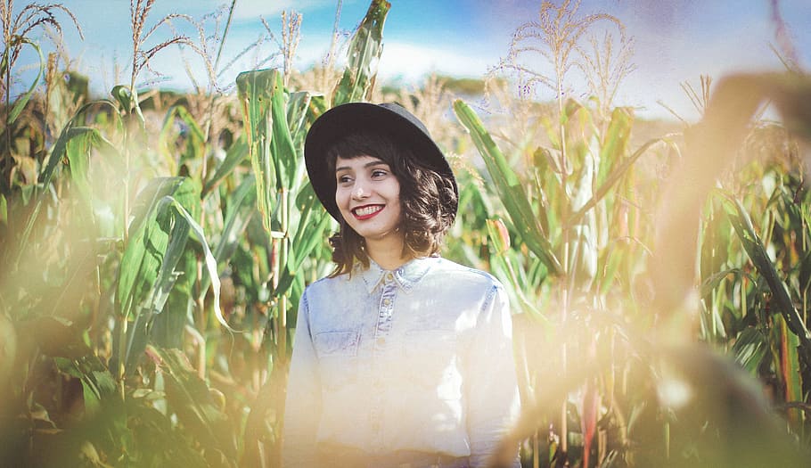 woman standing on corn field during daytime, women, nature, outdoors HD wallpaper