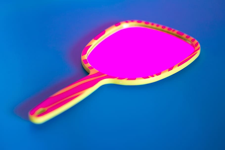 pink and yellow hand mirror, pink and yellow handheld mirror on blue surface HD wallpaper