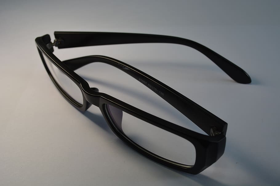 glasses, black-frame glasses, close-up, studio shot, indoors