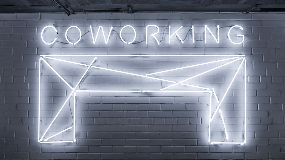 closeup photo of Co Working neon light sign, Coworking neon sign on wall
