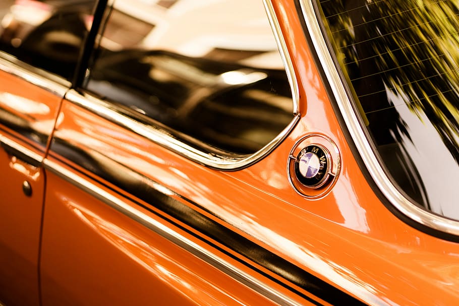 time lapse photography of orange BMW car, closeup photography of orange BMW coupe at daytime HD wallpaper