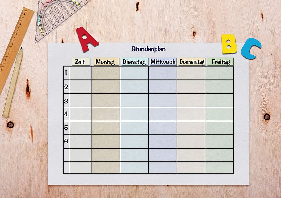 Studentplan paper near ruler, timetable, geodreieck, abc, alphabet