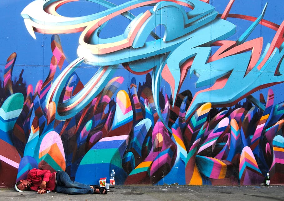 person sleeping on road beside wall graffiti, image, company HD wallpaper
