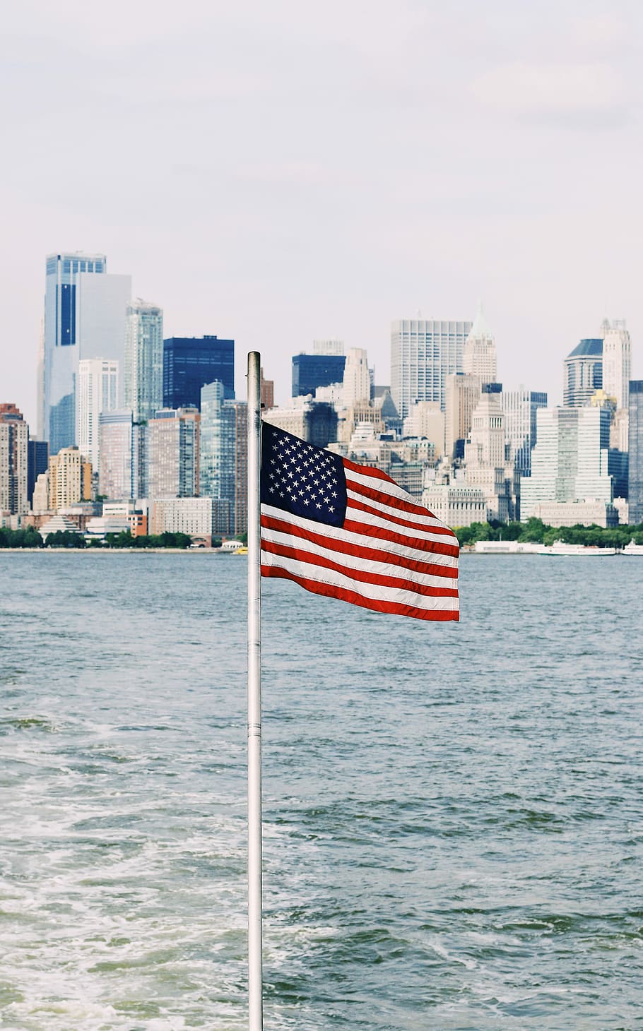 U.S.A. flag on pole near sea under cloudy sky, flag of USA near body of water, HD wallpaper