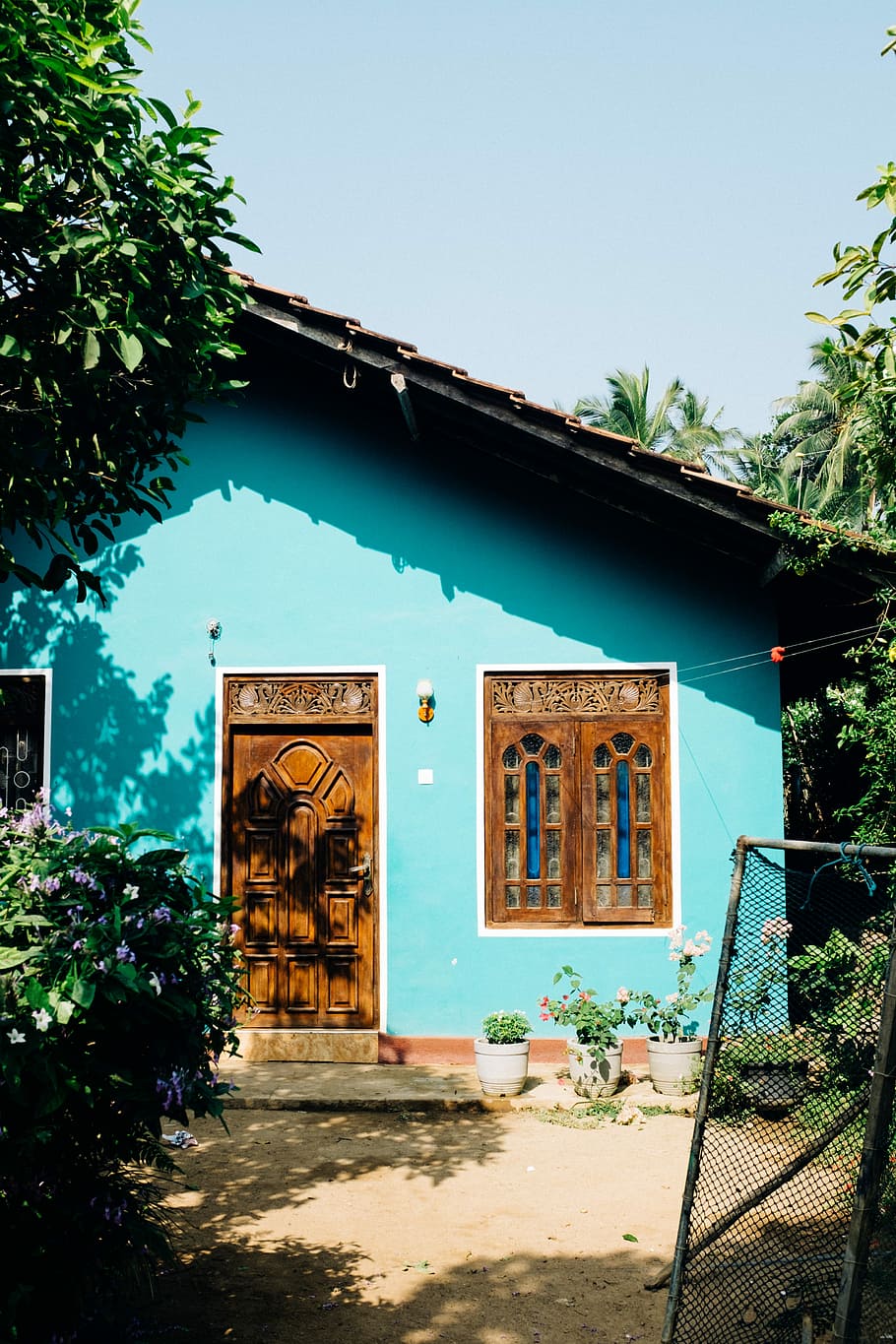 teal concrete house, building, door, window, sunlight, shadow HD wallpaper