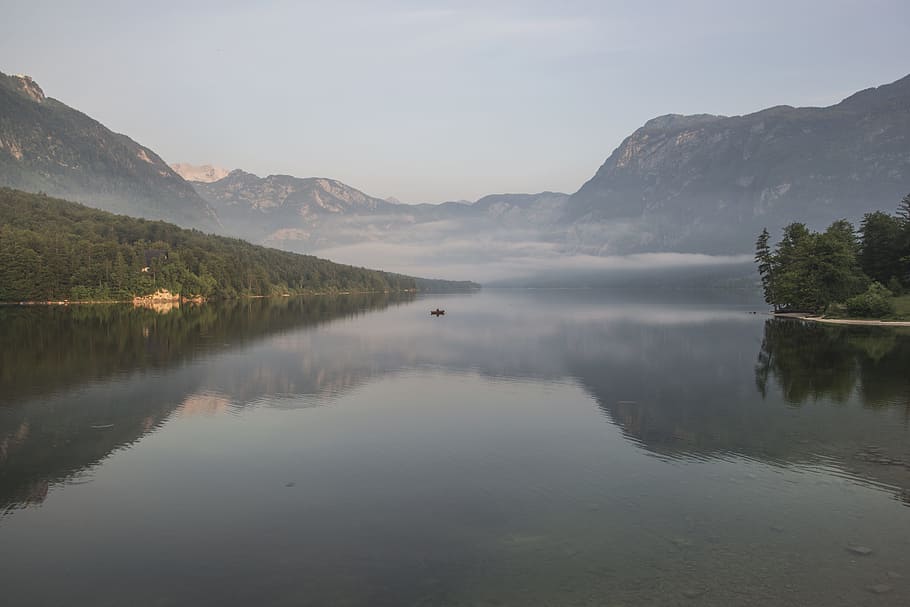 body of water near mountain ranges with green vegetation covered with fog during daytime, landscape of river HD wallpaper