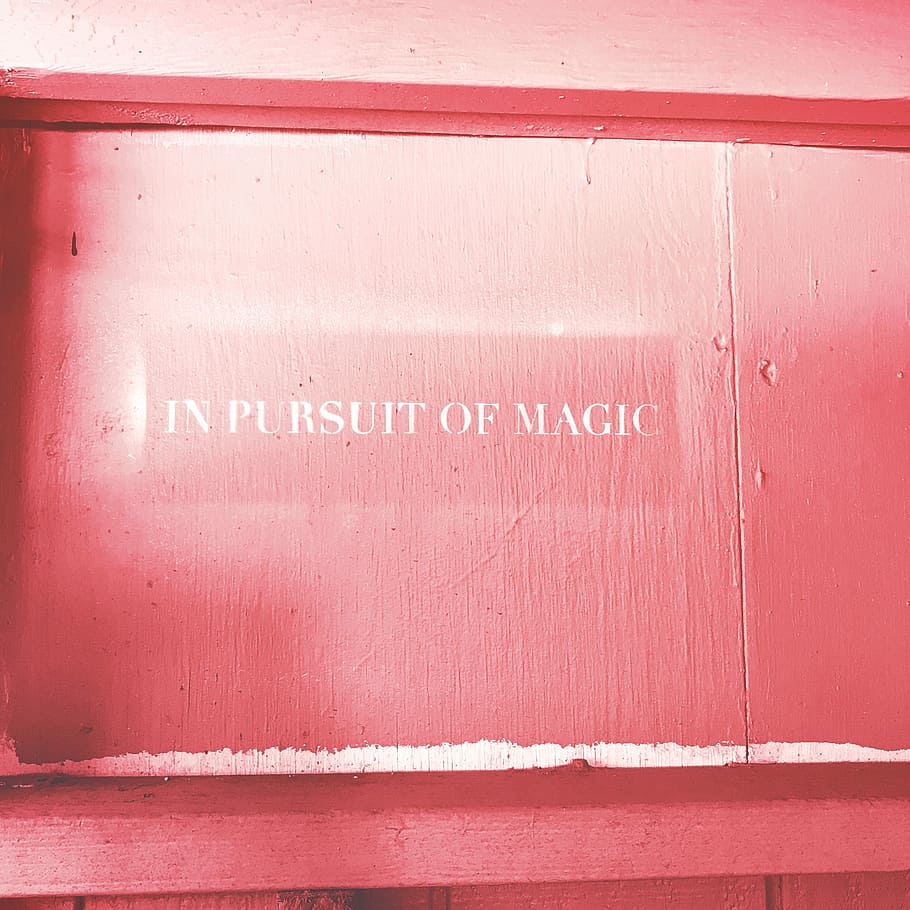 red wooden panel board, pink wooden board with in pursuit of magic text HD wallpaper
