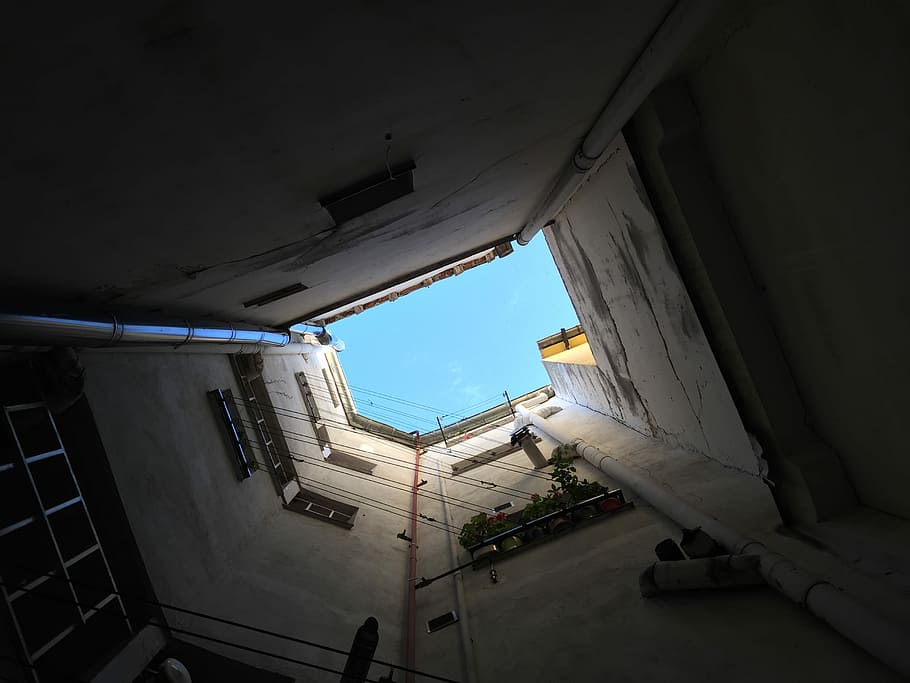gray concrete building under blue sky, worm's-eye view photo of building HD wallpaper