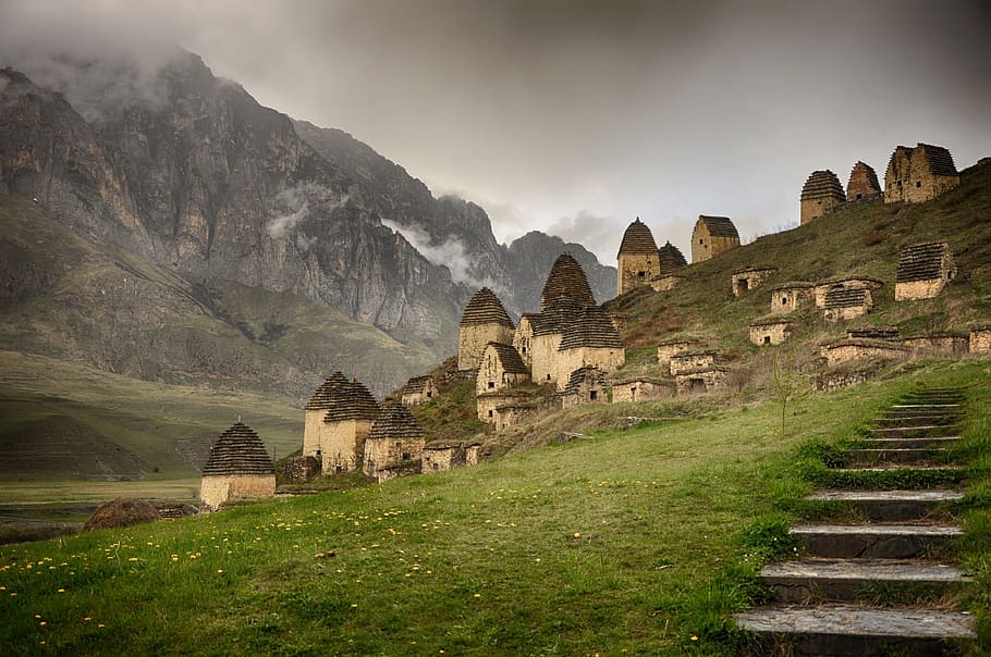 houses near rocky mountain during dayrime, dargavs, ossetia, kakaz