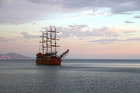 brown sailing ship with body of water photography during day time HD wallpaper