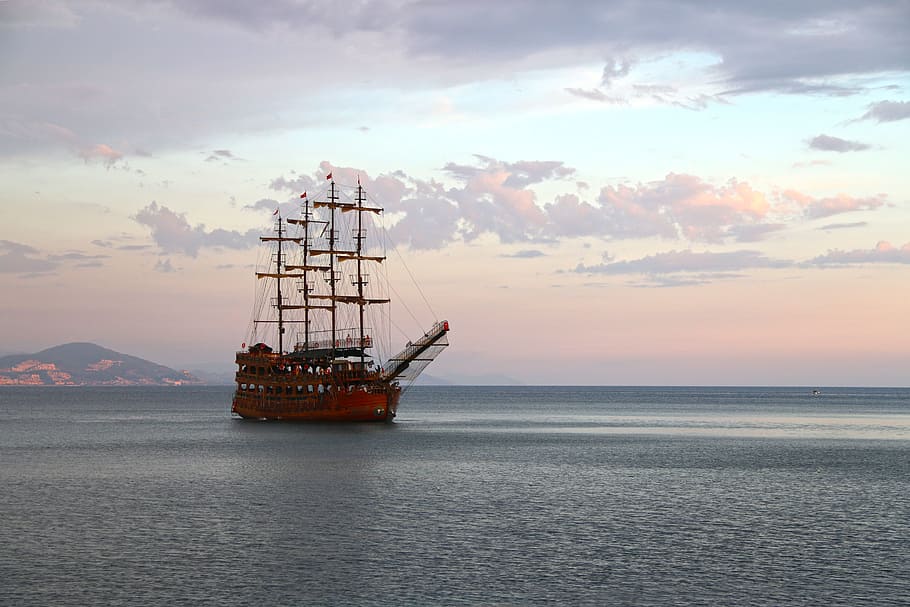 brown sailing ship with body of water photography during day time HD wallpaper