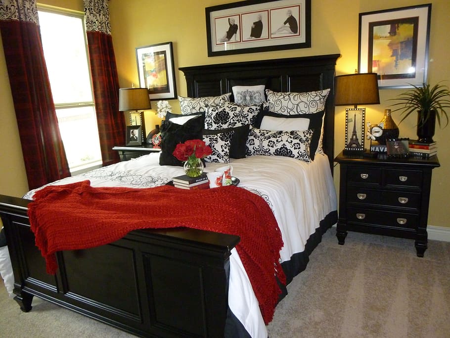 black wood-frame bed and nightstand with drawers, interior design