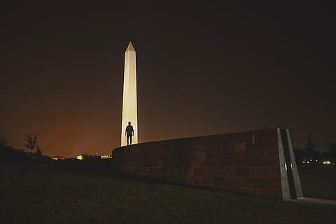 man standing on front of Obelisk in Egypt, silhouette man standing beside tower HD wallpaper