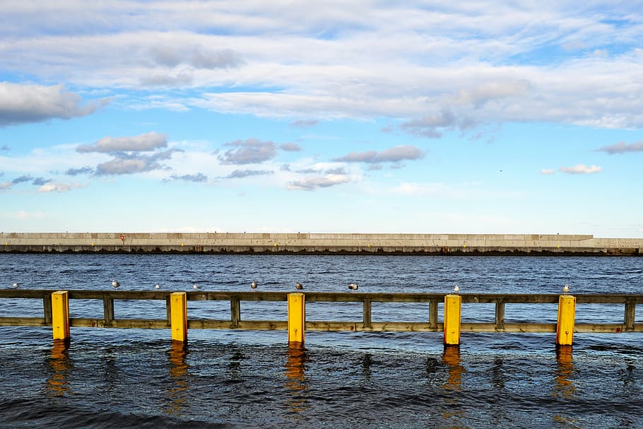 sea, clouds, sky, breakwater, the waves, poles, yellow, board HD wallpaper
