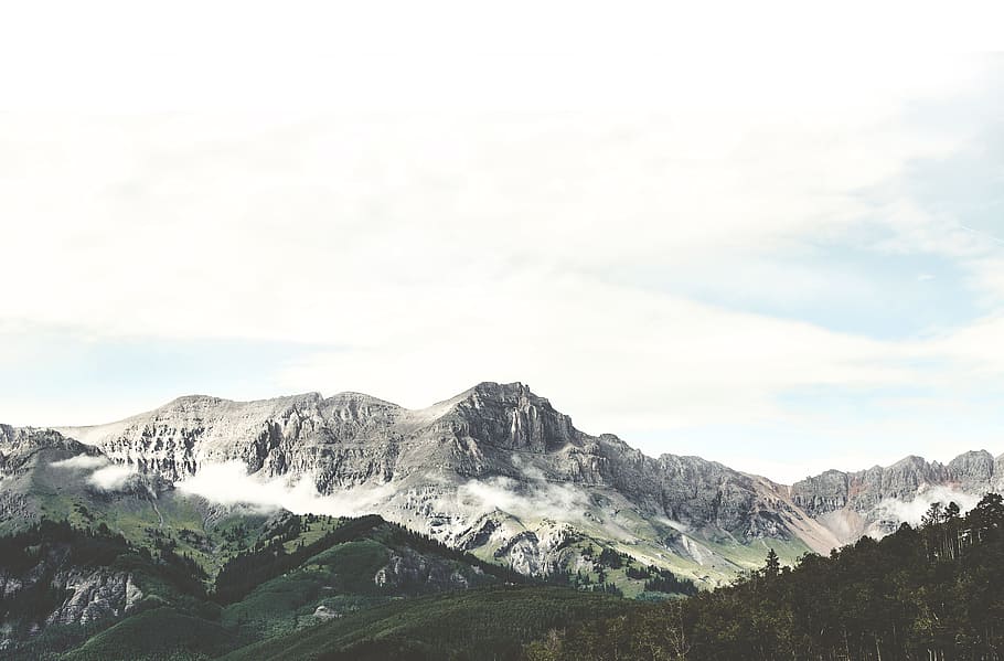 green mountains under blue sky, mountain and forest during daytime HD wallpaper