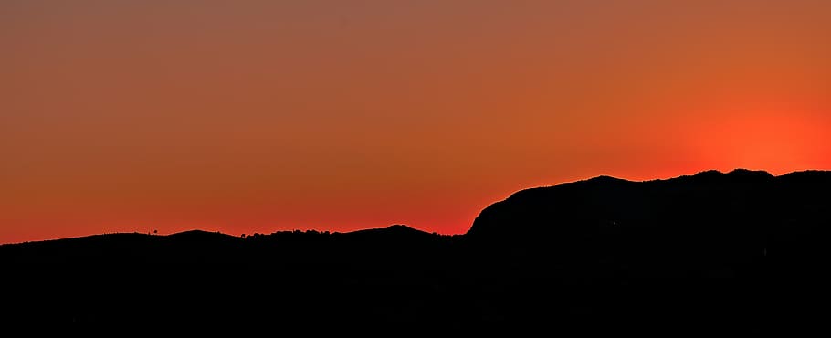 silhouette photography of mountains, dusk, orange, sky, dark HD wallpaper