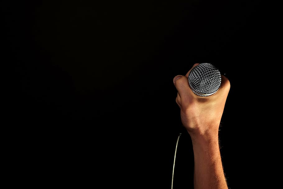 person holding corded microphone, hand, fist, isolated, black HD wallpaper