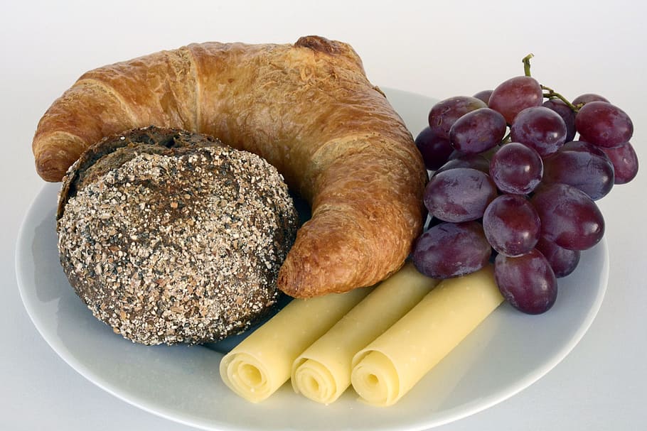 purple grapes beside croissant in plate, roll, summit, cheese HD wallpaper