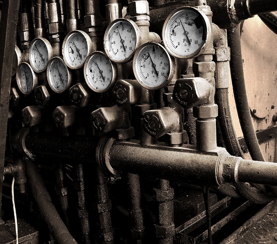 photography of pressure gauges, meters, armatures, pipes, factory