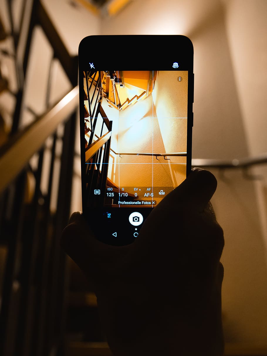 Person Holding Smartphone Showing Camera Application, capture HD wallpaper